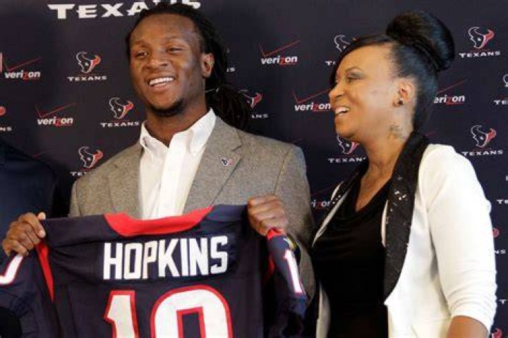Who burned DeAndre Hopkins Mom?