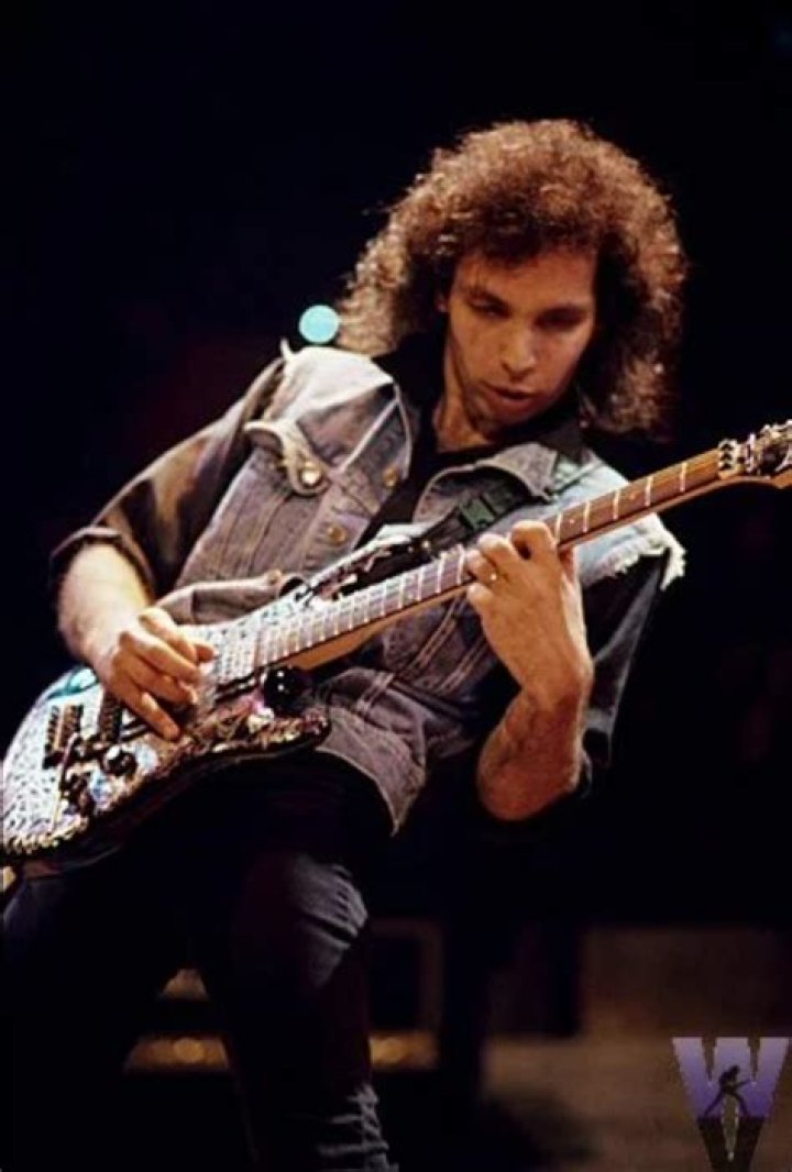 Why does Joe Satriani shave his head?